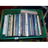 A crate of books including A Life of Picasso, Henry Moore, David Hockney, etc.