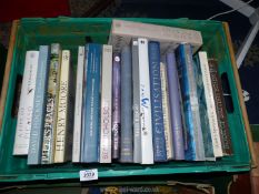 A crate of books including A Life of Picasso, Henry Moore, David Hockney, etc.