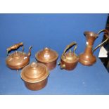 A quantity of copper including two kettles, jug, and two pots.