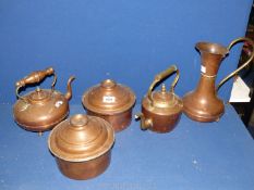 A quantity of copper including two kettles, jug, and two pots.