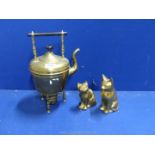 Two brass cats plus a brass kettle and burner.