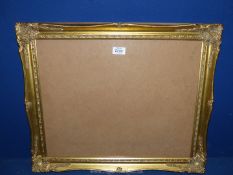 An ornate gilt picture Frame, glazed and backed, 23" x 19¼" frame with aperture of 19¼" x 15½".