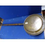 A copper warming pan with floral detail, (some damage to joint of handle).