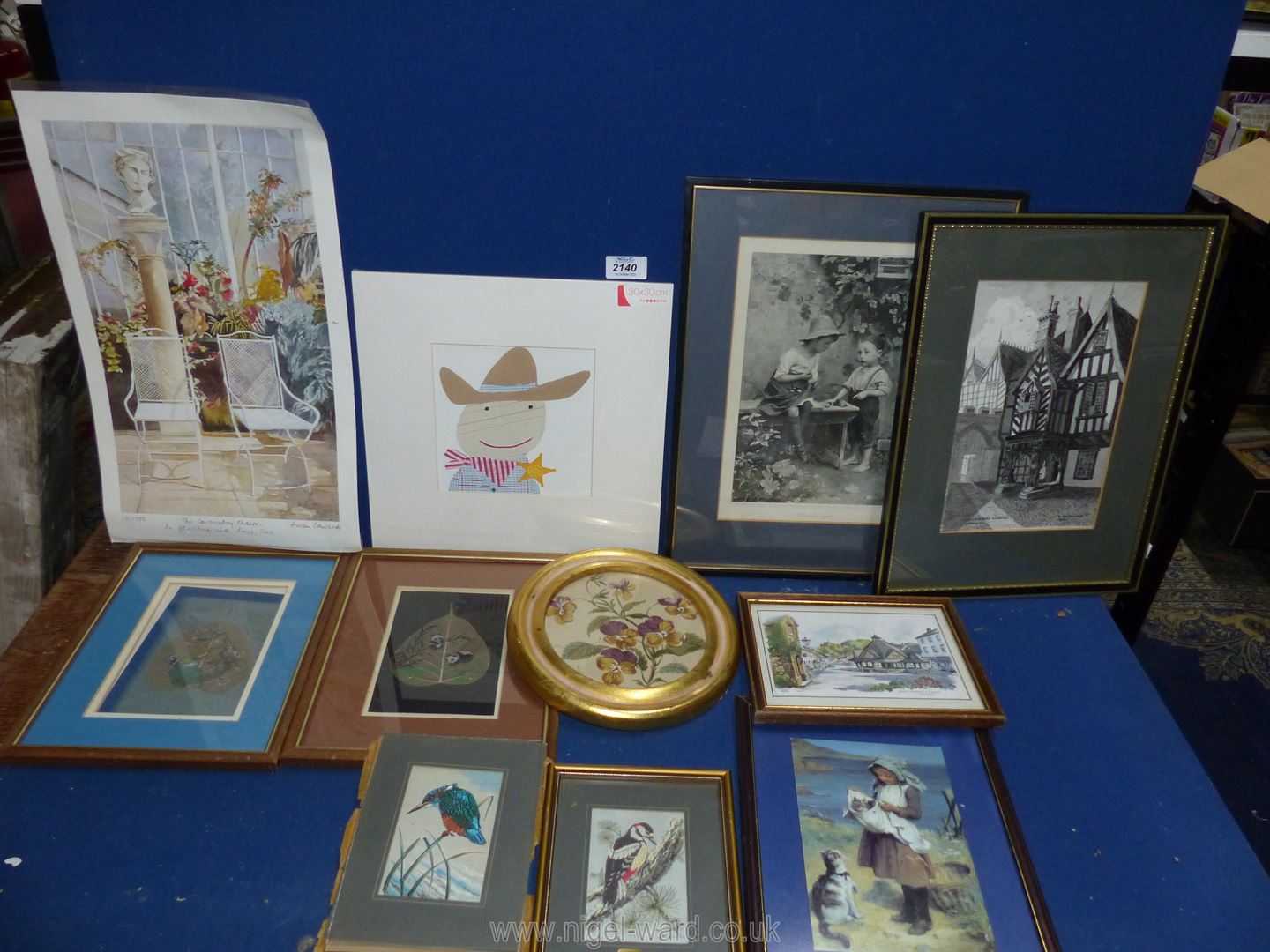 A quantity of prints to include; 'The Conservatory Chairs' by Susan Edwards, 'Cowboy',