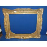 An ornate picture Frame (some damage to the plaster), 27½" x 22½" frame, aperture of 21¼" x 16¼".