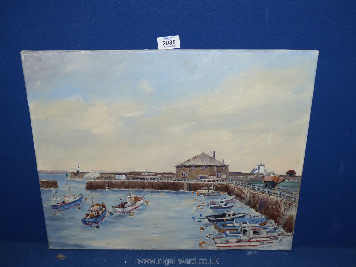An oil painting of Porthcawl harbour in the 1960's, signed Edwards.