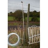 A hedge bill and a long armed pruner.