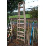 A ten rung wooden step ladder.