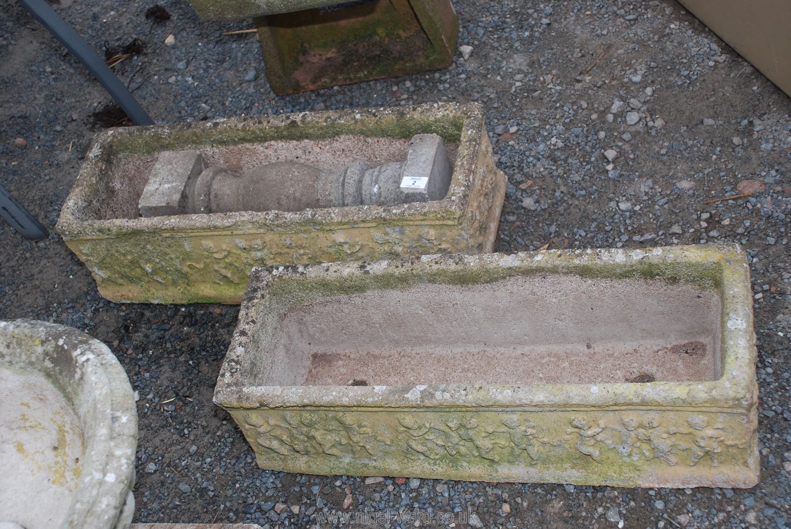 Two concrete planters and a concrete column, 26" x 9" x 7".