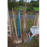 Three rakes, mallet, shovel, four fencing stakes.