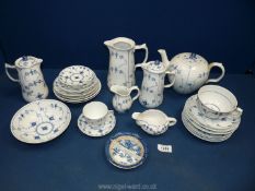 A quantity of Royal Copenhagen ''blue onion'' pattern china including teapot, jugs, cups,