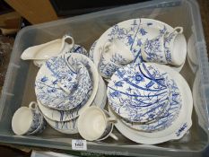 A large quantity of blue and white Staffordshire Ironstone dinner and tea ware including lidded