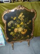 An Alsonea fire screen with floral display decoration, 29'' tall x 20'' wide.