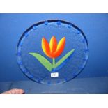A decorative glass Dish brightly painted with Tulip flower, 20th c, 13'' diameter.