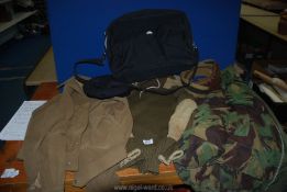 A gents camouflage coat, short suede jacket, army wool jumper, black skippers hat,