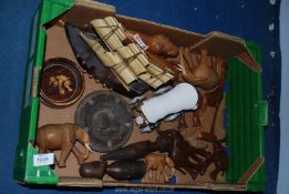 A quantity of wooden items including carved animals, sailing boat, ashtray, wagon, etc.
