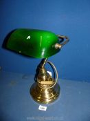 A Bankers lamp with brass effect base and green shade (chip to shade) 15 1/2" tall.