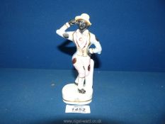 A highly unusual Staffordshire figure of a black faced dancer, perhaps a minstrel, circa 1880-1900.