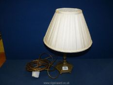 A brass Table Lamp having six sided base with bun feet and cream Laura Ashley silk shade.