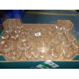 A box of attractive plain glasses including wine, sherry, champagne flutes and bowls.
