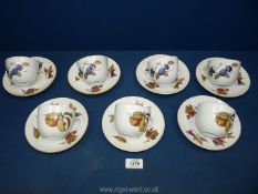 A quantity of Royal Worcester Evesham cups and saucers.