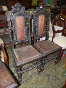 A pair of 19th century or earlier Oak Hall Chairs having twist supports and stretchers,