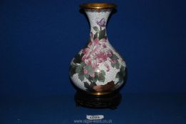 A cloisonne vase with butterfly and floral detail on stand, 9½" tall.