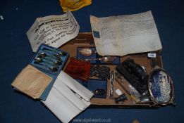 A quantity of miscellaneous including a red velvet purse, cased teaspoons, old photograph frames,