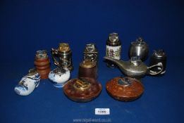 A quantity of mixed table lighters to include one in the form of a genie lamp, Delft ware, wooden,