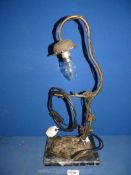 An Art Nouveau style table lamp with iron branch lamp holder and marble base, 19'' high overall.