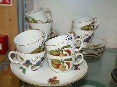 A part Royal Worcester Evesham tea set including six cups and saucers, six tea plates, cream jug,