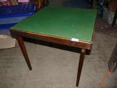A folding 'Vono' card table with green baize top 24" square x 20 1/2" tall.