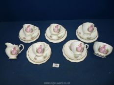 A part bone china Teaset with Crinoline lady design, some wear.