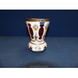 A Bohemian overlaid red glass Goblet, painted with flowers and enhanced with gilding, 20th c.