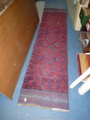 A hand knotted carpet Runner, blue and red geometric pattern, 2m x 3.8m.