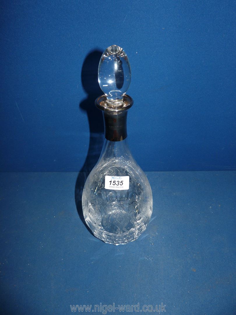 A limited edition Turkish/Cypriot glass decanter with etched design and white metal collar, boxed,