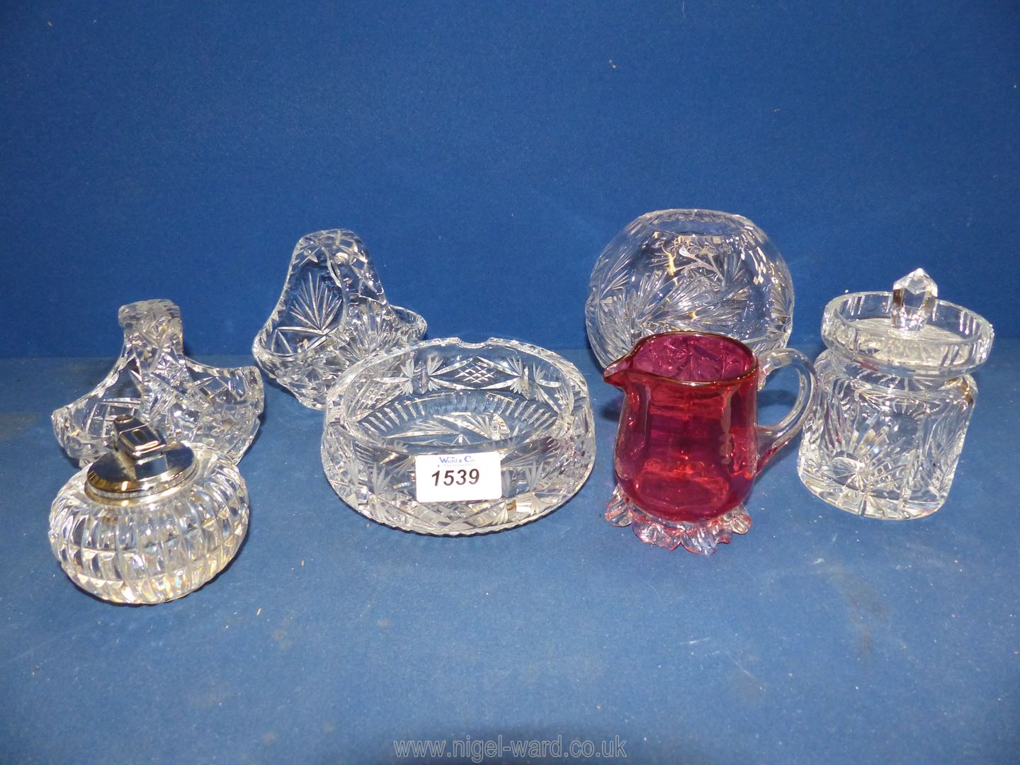 A quantity of cut glass including ashtray, rose bowl, flower baskets, preserve pot etc.