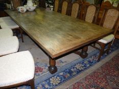 A contemporary mixed hardwoods refectory/dining Table,