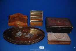 A quantity of wooden items including a mother of pearl tray, two desk tidies and two wooden boxes.