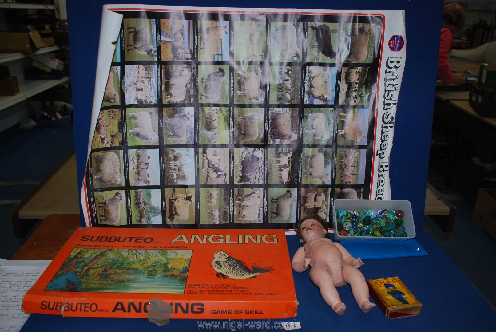 A boxed Subbuteo "Game of Angling" plus a doll by Thuringia of Germany, snap card game,