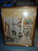 A raised needlepoint framed picture of harbour scene 25" x 20".