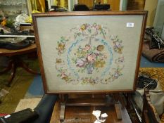 A folding Side table/firescreen with floral pattern tapestry panel, 25 1/4" x 28 1/2" high.
