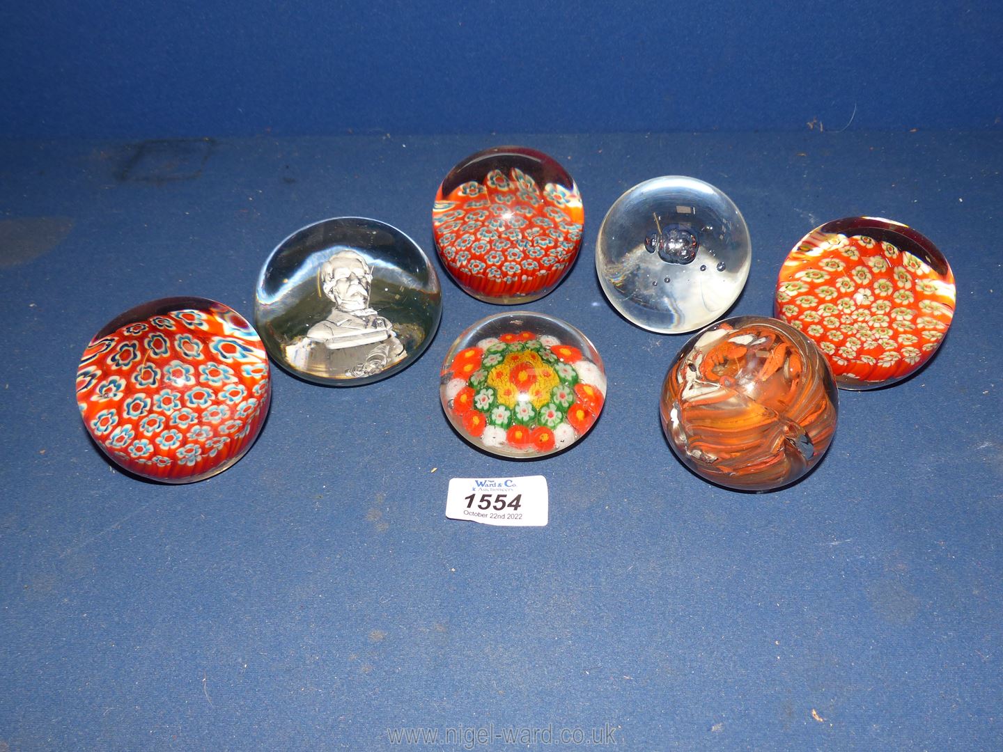 Seven glass paperweights, mostly Millefleur style etc.