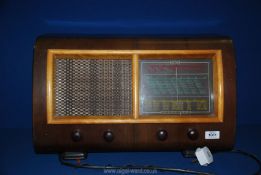 A wooden cased Ultra radio with four Bakelite knobs 21½" wide x 13" high x 10" deep.