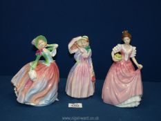 Three Royal Doulton ladies to include 'Autumn Breezes' lady in green jacket and bonnet 7¾",