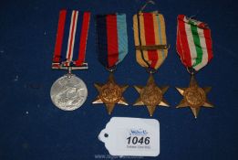 Four World War II Medals to include The 1939-1945 Medal, The 1939-1945 Star,