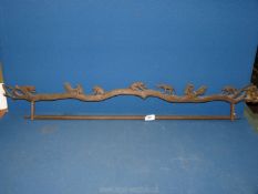 An unusual wall rack with a tableau of carved monkeys on a branch, some damage,