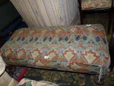 A low nicely re-upholstered double Stool standing on turned and lobed legs,