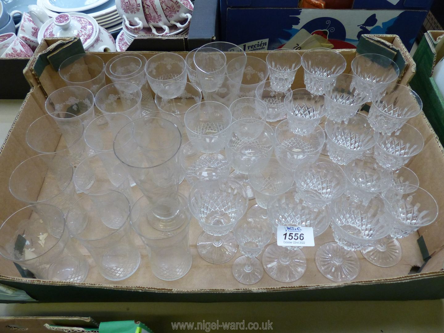 A quantity of glasses including etched tumblers and cut and etched wine and sherry glasses etc.