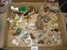 A box of miniature animal figures including Wade Whimsies, Sylvac Donkey, Szeiler Zebra, W.R.